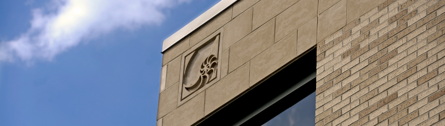The exterior wall of the college of business features a nautilus etched into the stone.