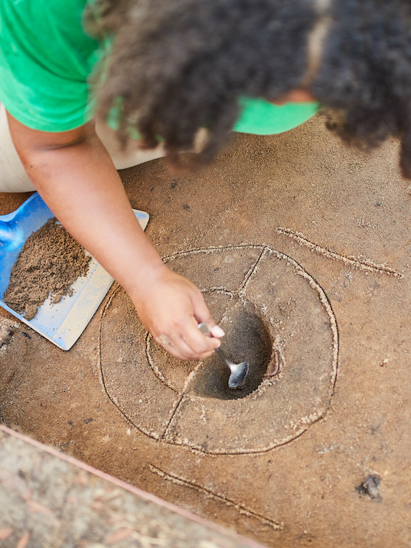 an archaeology student working on a dig