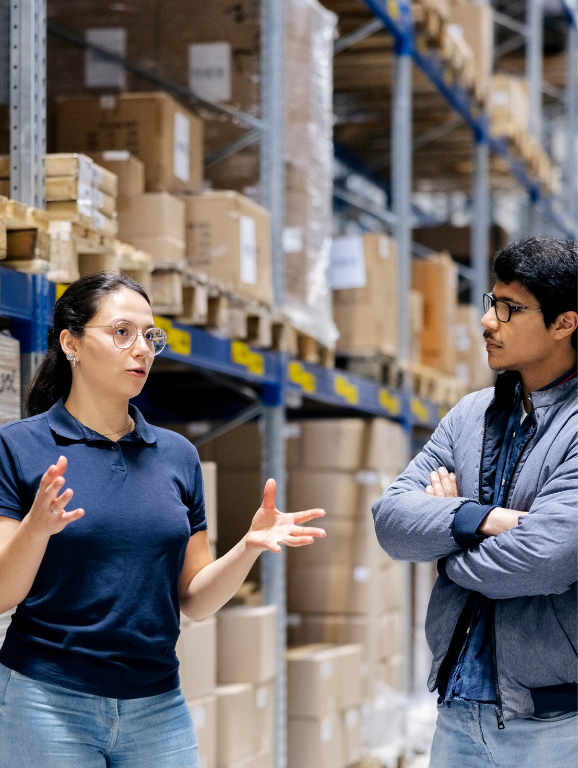 Supply Chain Logistics professionals in discussions in warehouse
