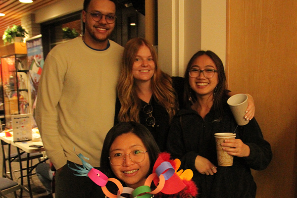 Students posing with coffee cups
