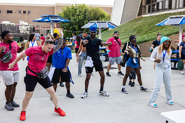 students dancing to dj