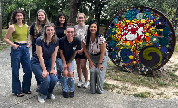 Students standing together in a group outside of the Psychology building.
