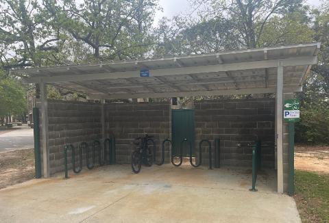 Image of covered bike rack charging station between buildings 32 and 38