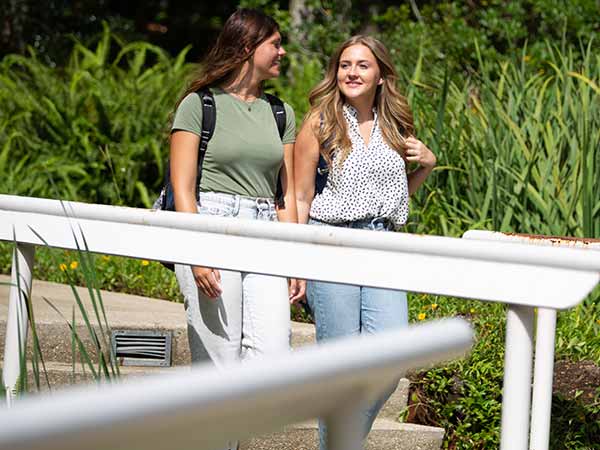 two students walking on the pensacola campus