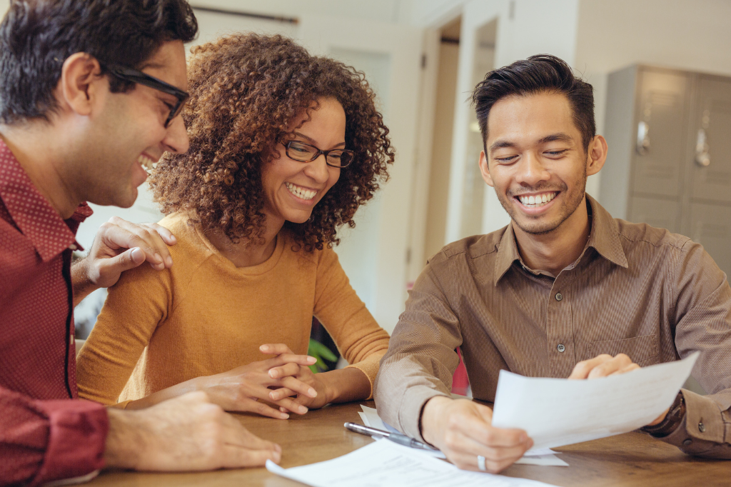 Group of adults looking at a paper