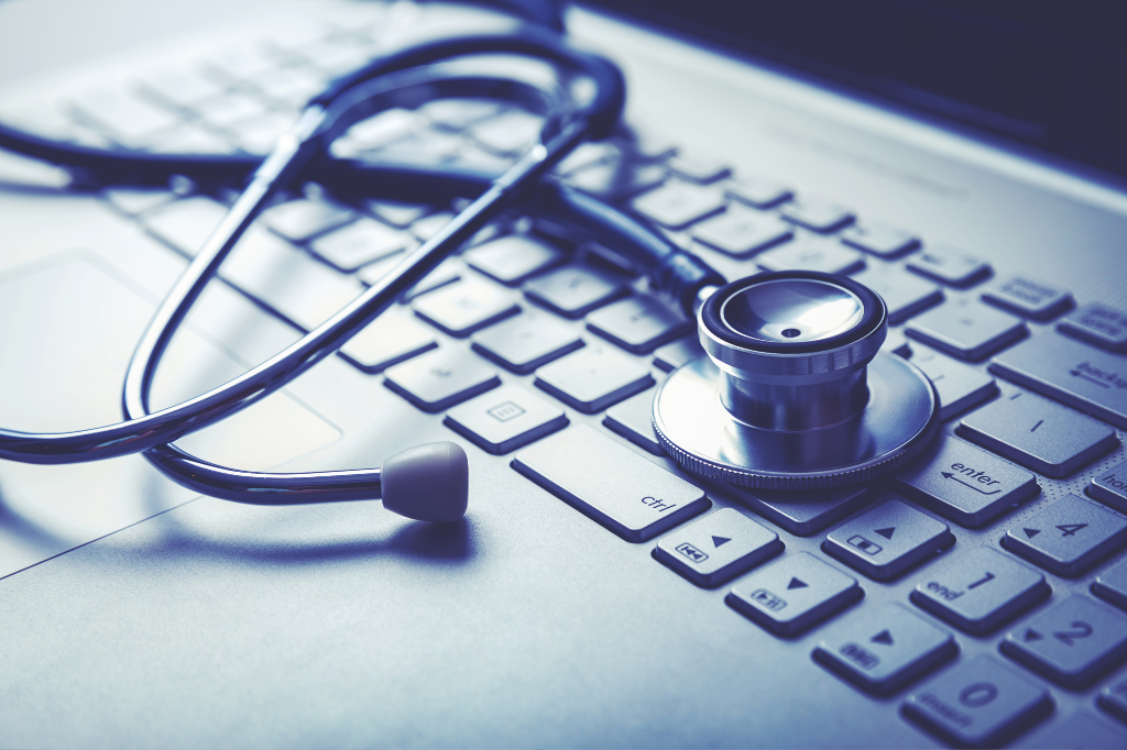 Stethoscope laying on a laptop keyboard