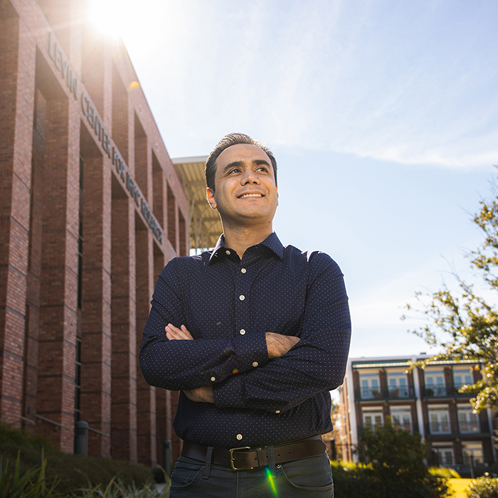 Outdoor portrait of Taher Rahgooy standing in front of the IHMC building.